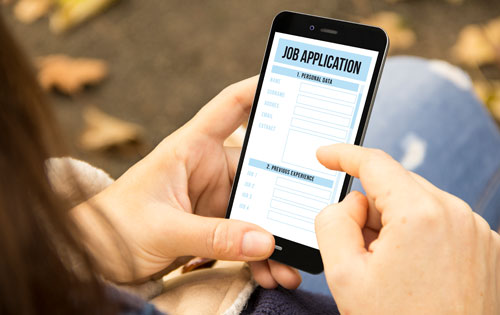 Person filling out job application on their mobile phone