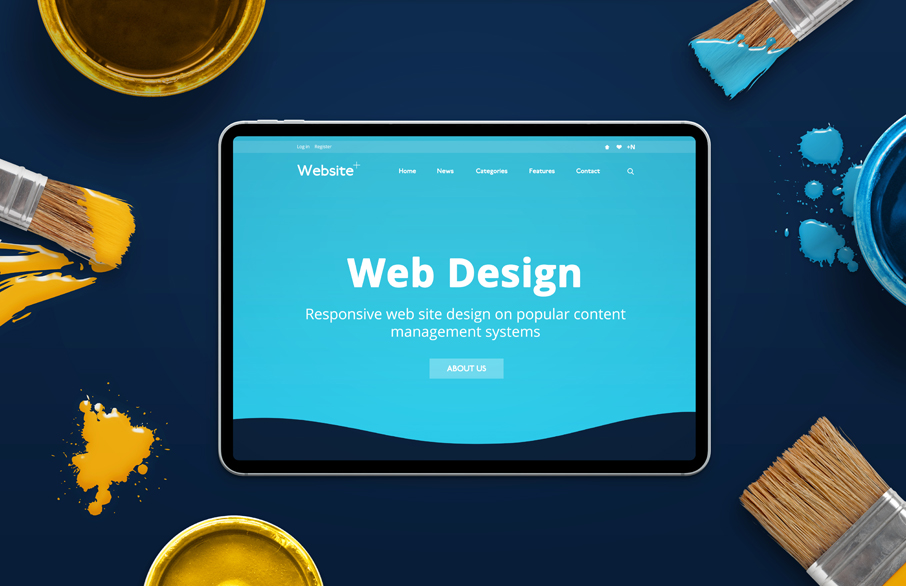 Ipad with a website on the screen that says "web design"