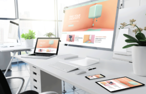 All white office setup with the text "find your creativity" displayed on various devices